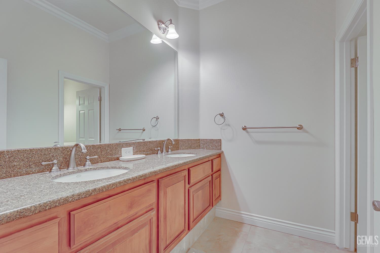 Undisclosed Address Bakersfield, CA 93311 - Photo 28 of 41 a bathroom with a granite countertop sink and a mirror