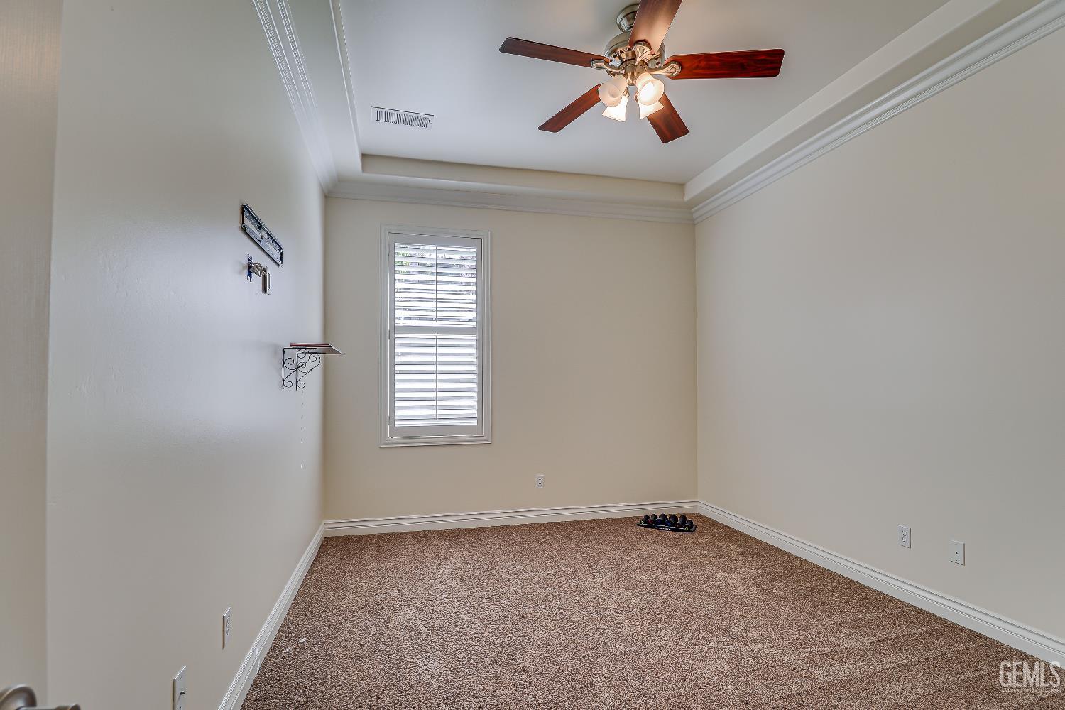 Undisclosed Address Bakersfield, CA 93311 - Photo 31 of 41 an empty room with windows and fan