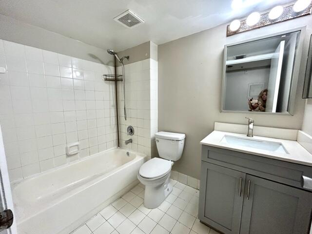 741 North Pine Island Road, Unit 303 Plantation, FL 33324 - Photo 16 of 32 a bathroom with a granite countertop sink toilet and shower