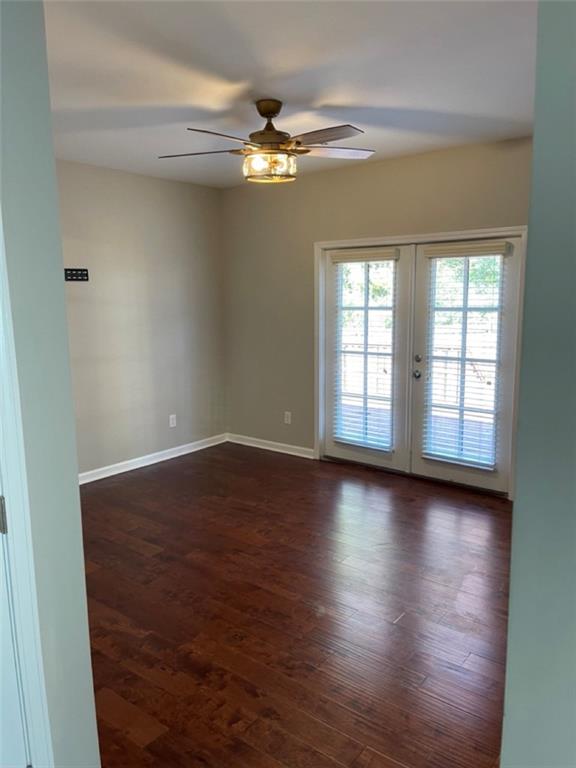 3544 College Street Atlanta, GA 30337 - Photo 11 of 17 an empty room with wooden floor and windows