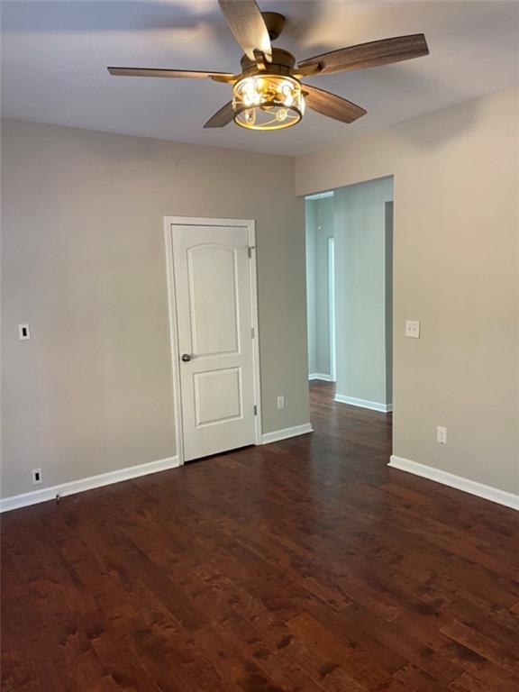 3544 College Street Atlanta, GA 30337 - Photo 12 of 17 a view of an empty room with chandelier fan and wooden floor