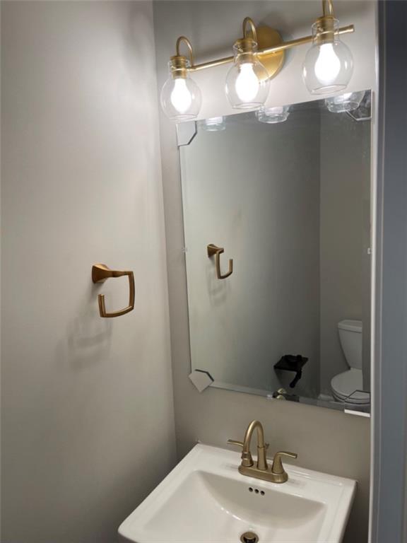 3544 College Street Atlanta, GA 30337 - Photo 13 of 17 a bathroom with a sink and mirror