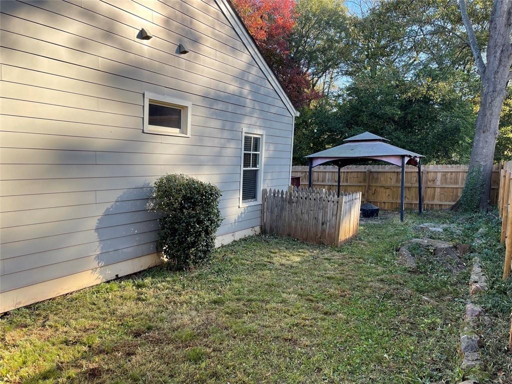 3544 College Street Atlanta, GA 30337 - Photo 16 of 17 a view of a house with a yard and a garden