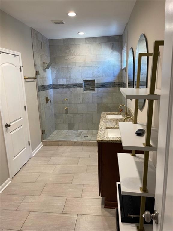 3544 College Street Atlanta, GA 30337 - Photo 7 of 17 a bathroom with a sink a toilet and mirror