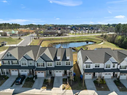 an aerial view of a house with a big yard