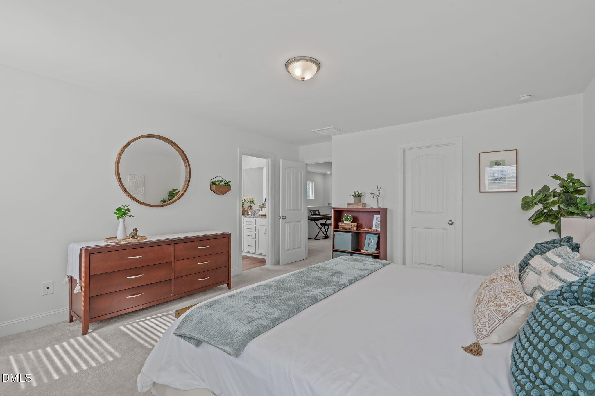207 Marbella Grove Durham, NC 27713 - Photo 29 of 48 a bedroom with a bed and a dresser
