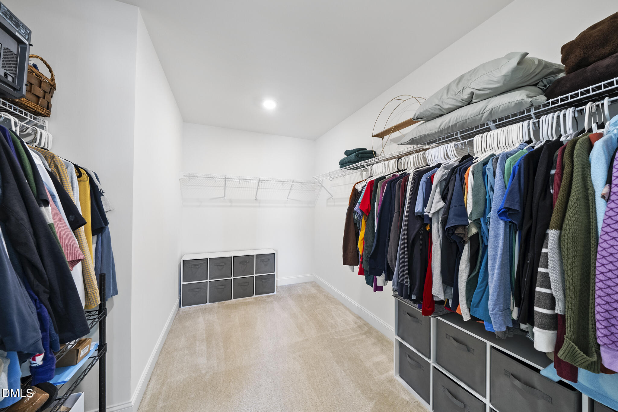 207 Marbella Grove Durham, NC 27713 - Photo 33 of 48 a view of walk in closet with clothes and shoes