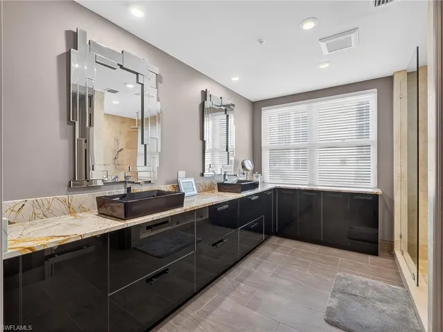 a bathroom with a glass shower door