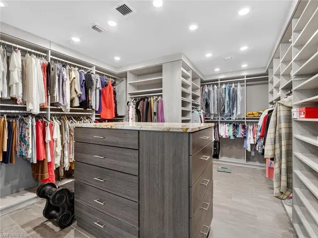 a view of a patio with dining table and chairs