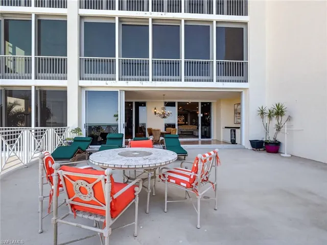 an aerial view of a house with outdoor space patio and outdoor seating