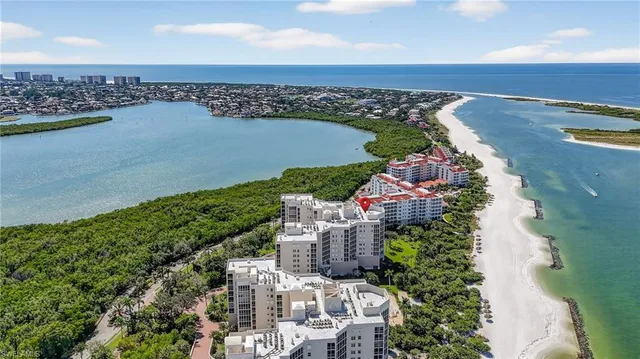 an aerial view of a house with a lake view