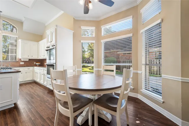 a view of a dining room with furniture and wooden floor