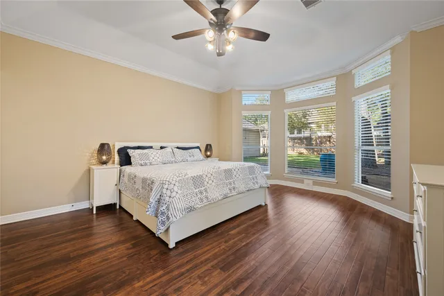 a bedroom with a bed and window