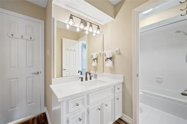 a bathroom with a sink double vanity and a mirror