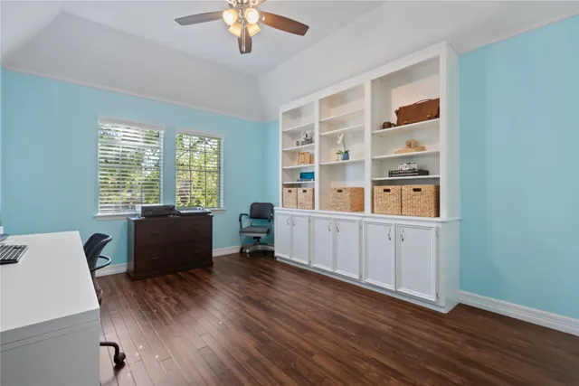 a workspace with furniture window and wooden floor