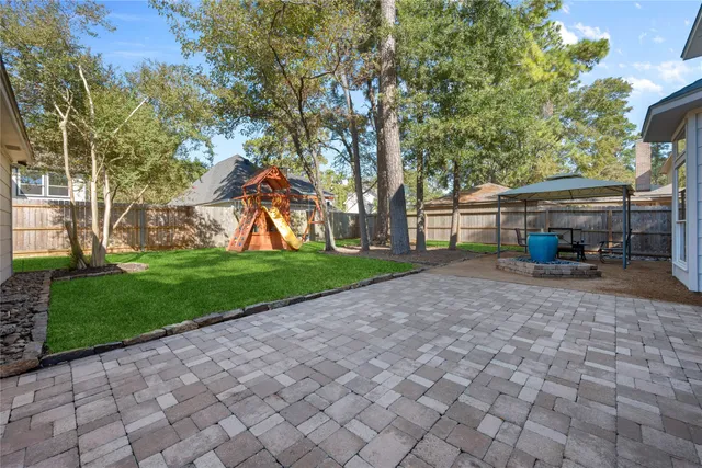 a view of a yard with furniture and a small yard