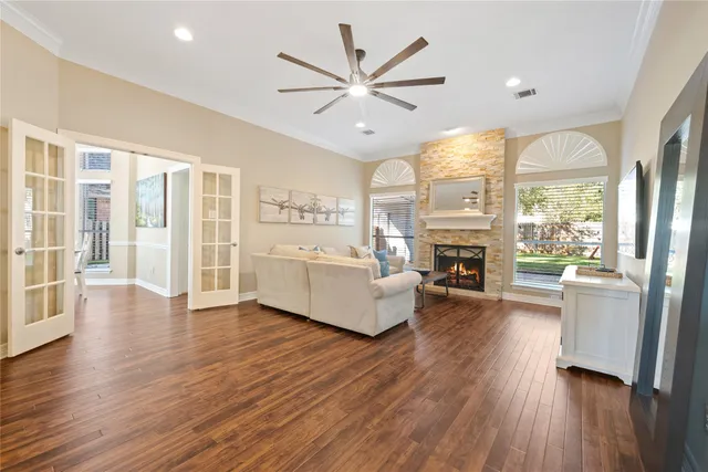 a living room with furniture wooden floor and a fireplace
