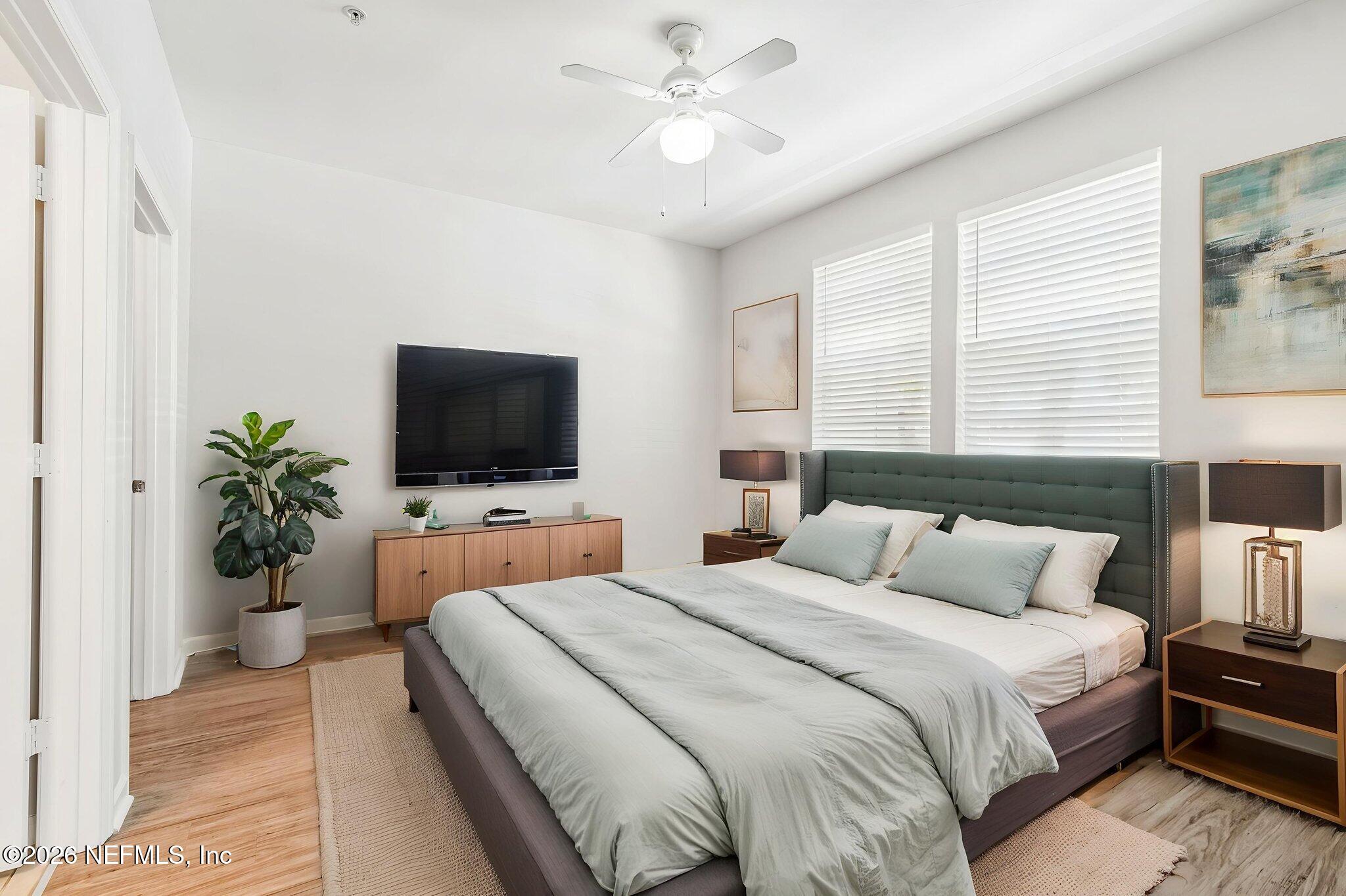 8550 Touchton Road, Unit 511 Jacksonville, FL 32216 - Photo 33 of 63 a bedroom with a bed and a flat screen tv