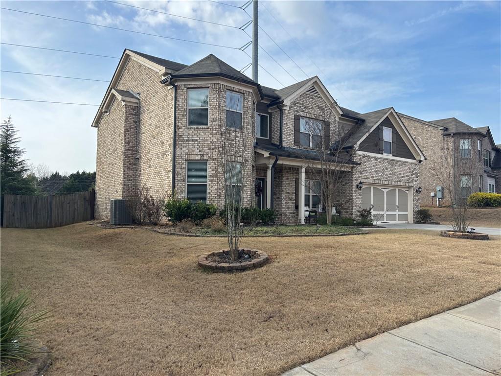3459 In Bloom Way Auburn, GA 30011 - Photo 2 of 35 a front view of house with yard