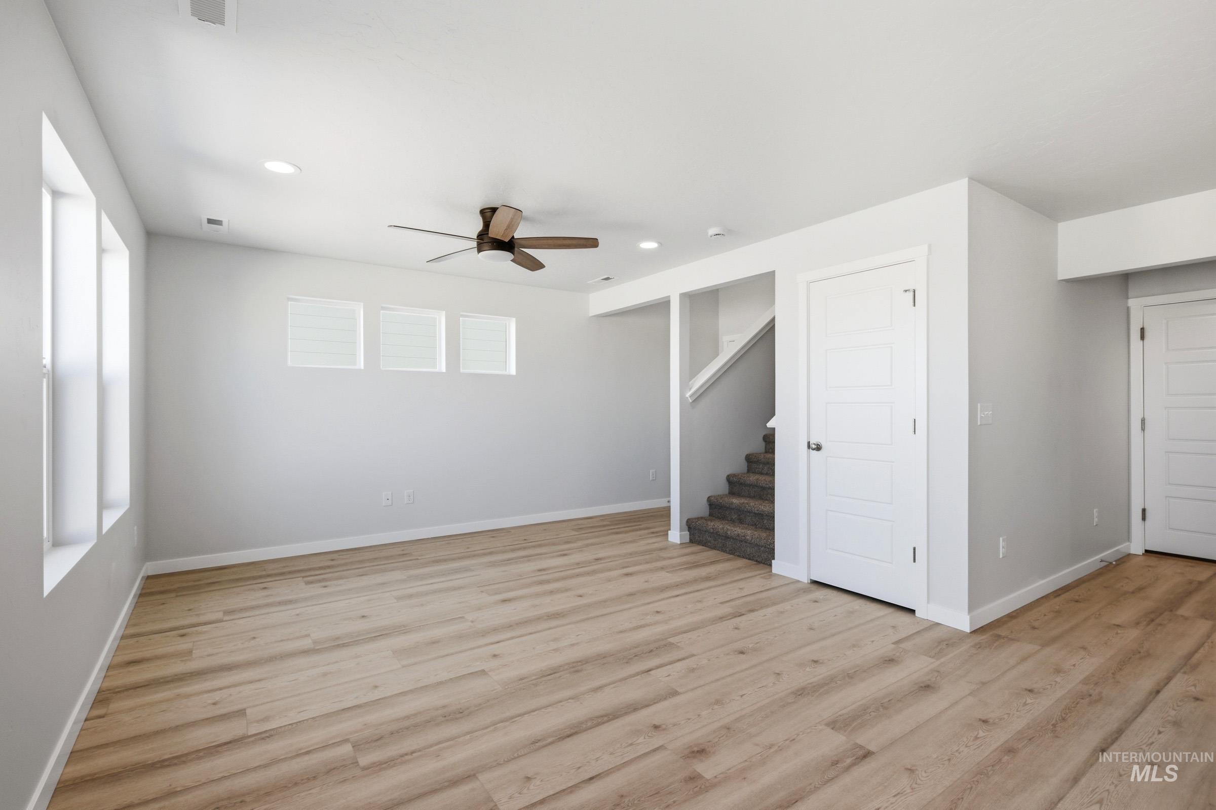 10794 Rutland Street Caldwell, ID 83605 - Photo 9 of 22 Spacious room featuring wood-finish flooring, recessed lighting, and a ceiling fan
