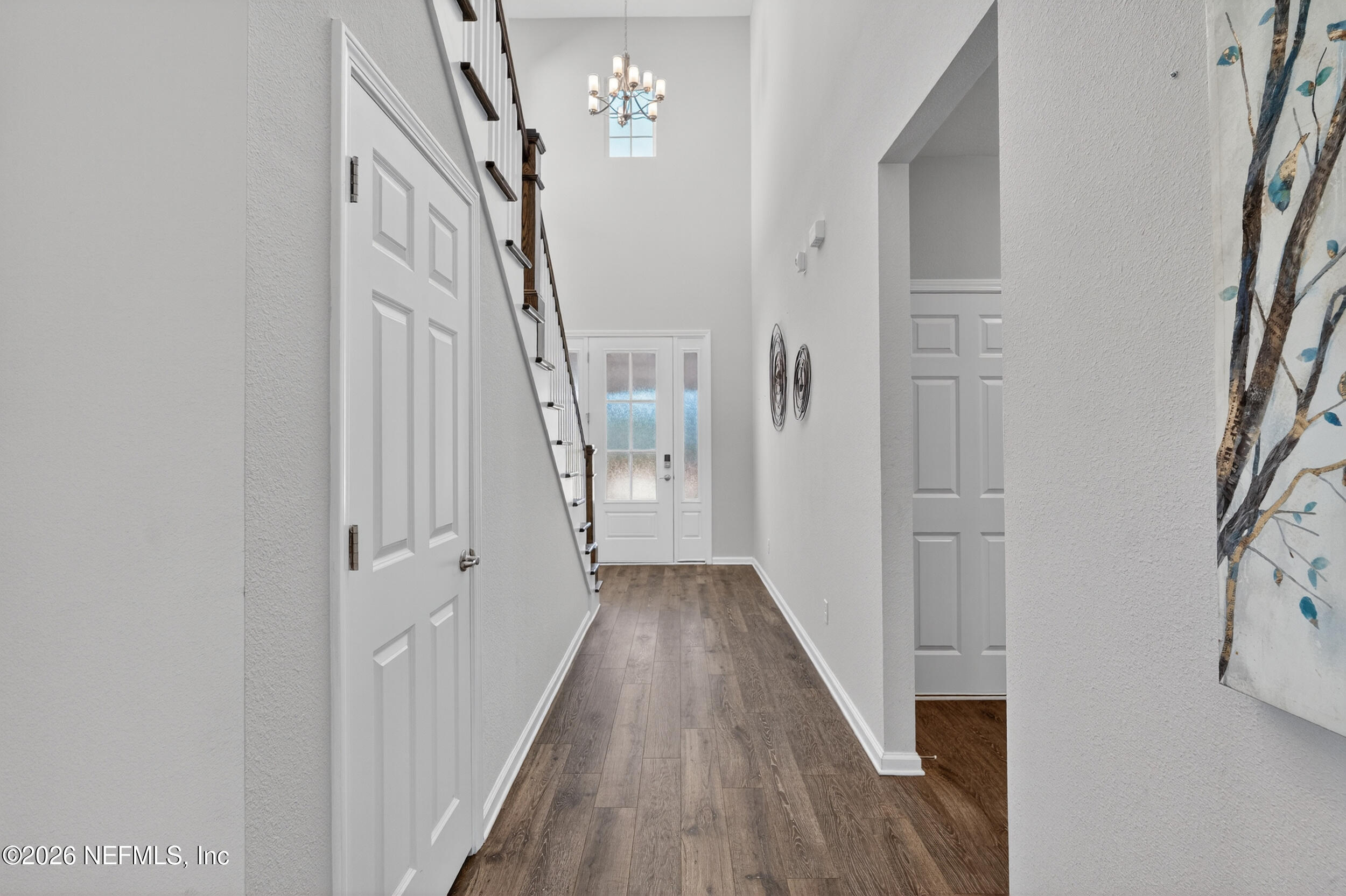 103 Ferndale Way St. Augustine, FL 32092 - Photo 13 of 54 a view of a hallway with wooden floor and staircase