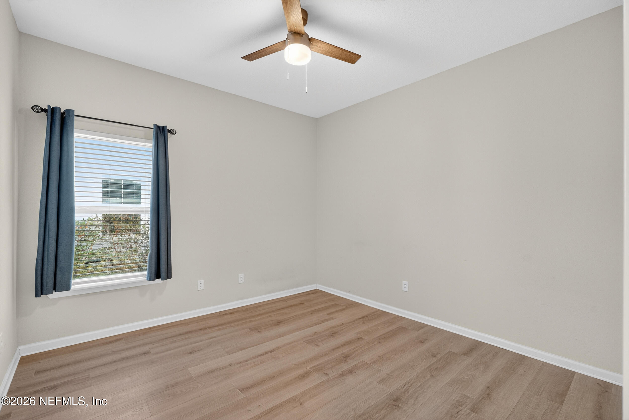 103 Ferndale Way St. Augustine, FL 32092 - Photo 16 of 54 wooden floor in an empty room with a window