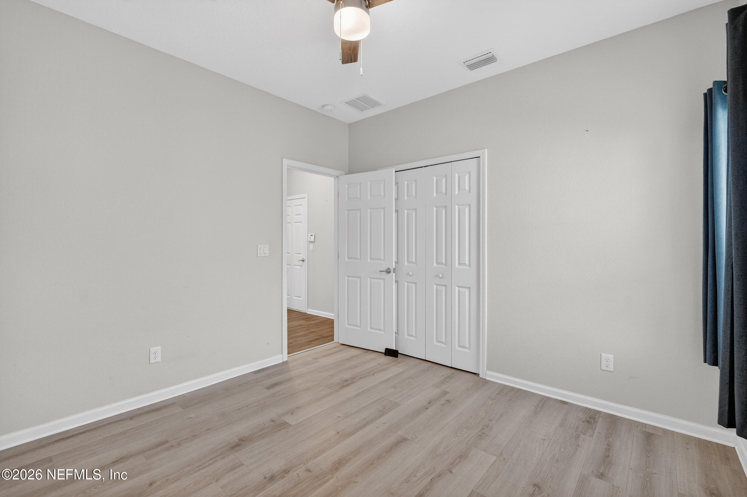 103 Ferndale Way St. Augustine, FL 32092 - Photo 17 of 54 a view of an empty room with wooden floor