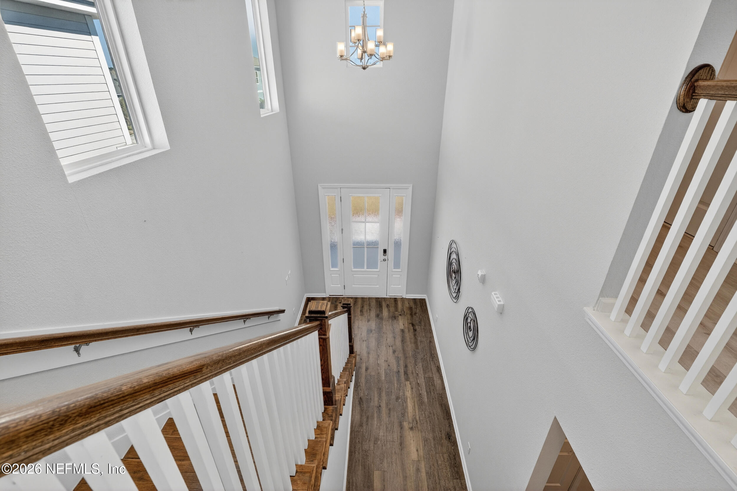 103 Ferndale Way St. Augustine, FL 32092 - Photo 19 of 54 a view of a hallway with wooden floor and staircase