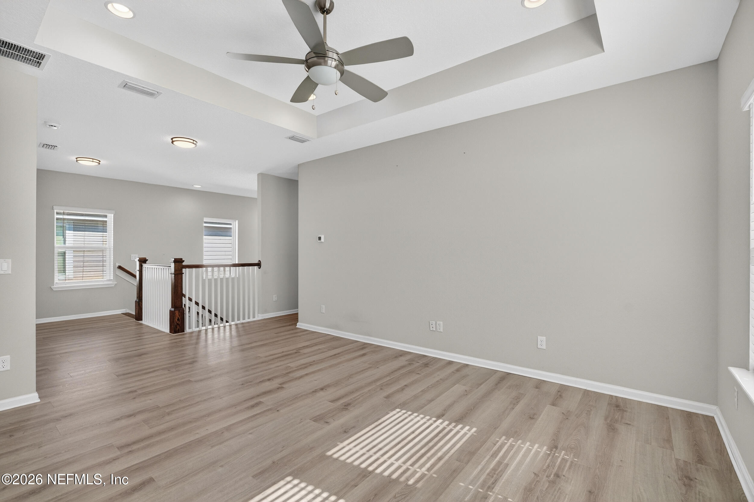 103 Ferndale Way St. Augustine, FL 32092 - Photo 21 of 54 wooden floor in an empty room with a window