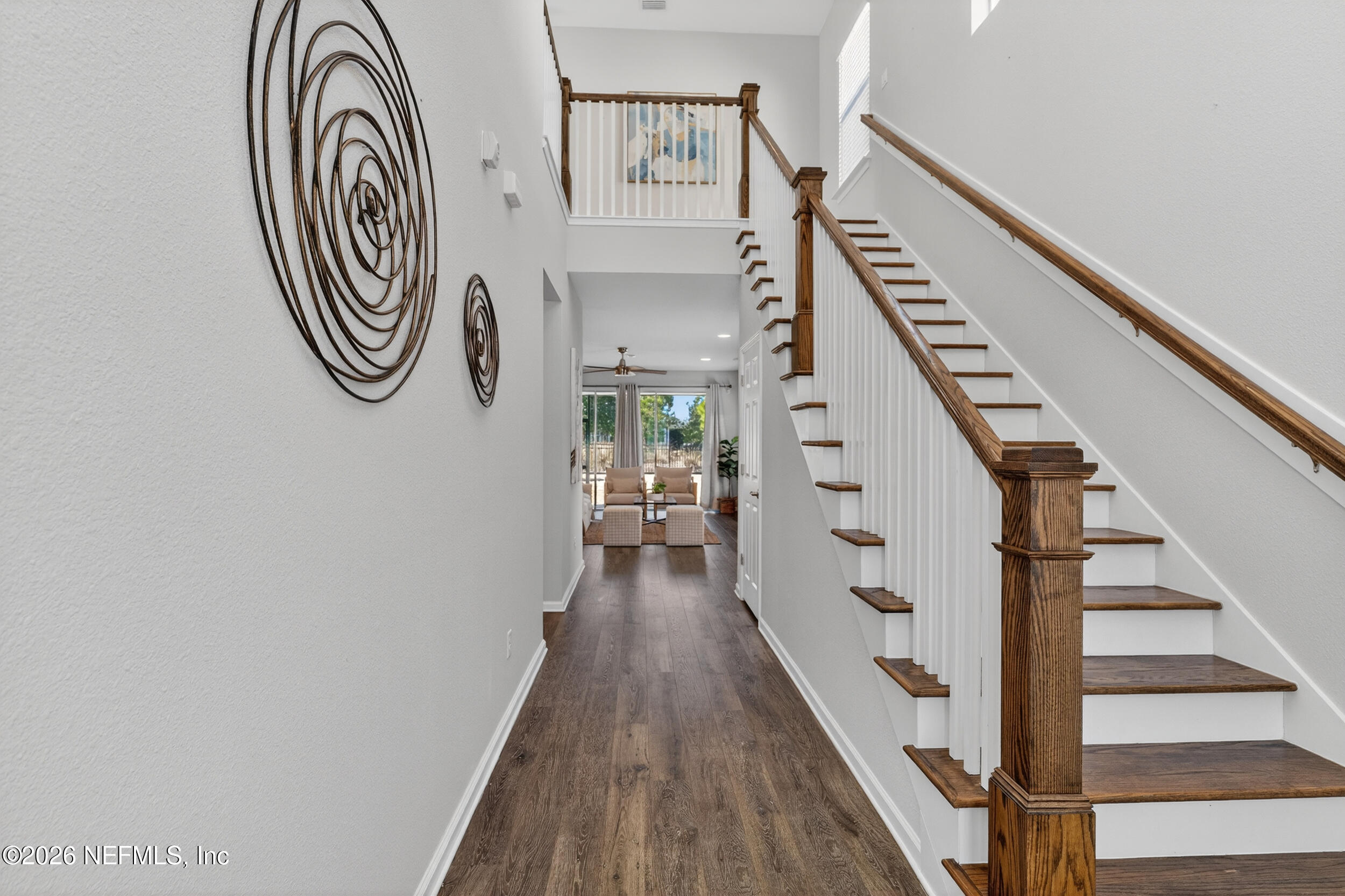 103 Ferndale Way St. Augustine, FL 32092 - Photo 3 of 54 a view of a hallway with wooden floor