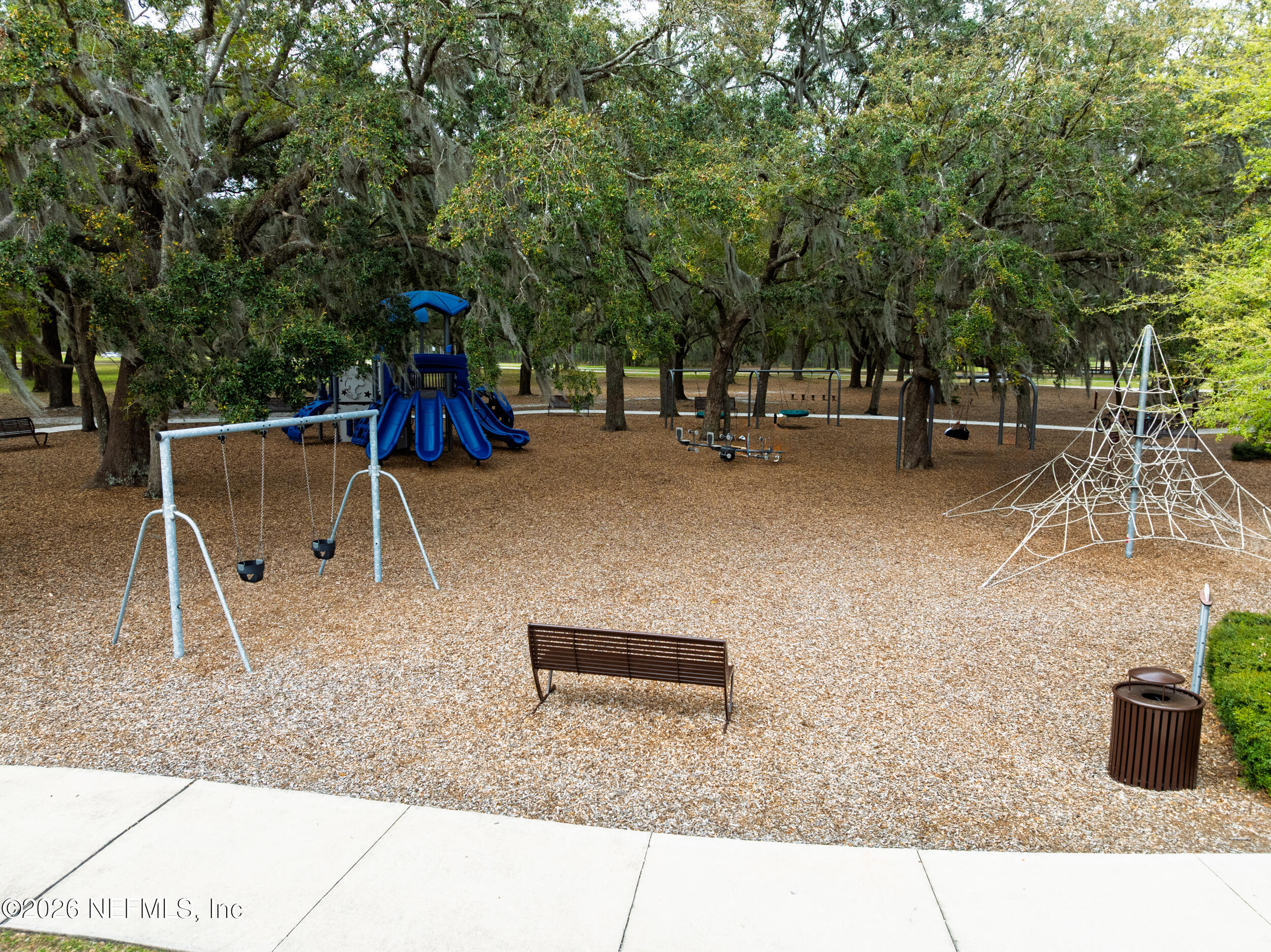 103 Ferndale Way St. Augustine, FL 32092 - Photo 53 of 54 a backyard of a house with table and chairs