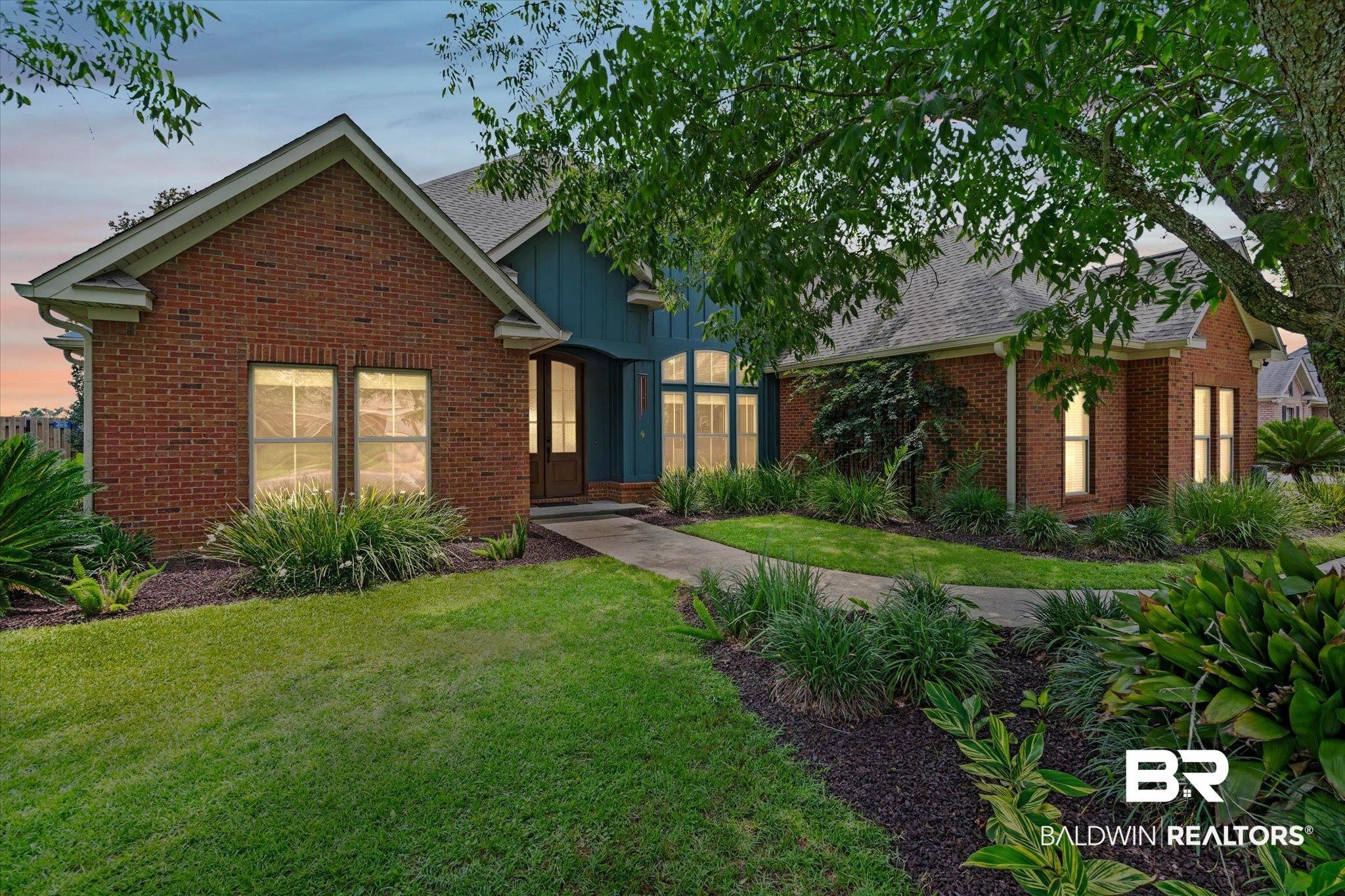 24908 Bosbyshell Avenue Daphne, AL 36526 - Photo 48 of 49 Brick exterior with gabled roofline and contrasting vertical siding