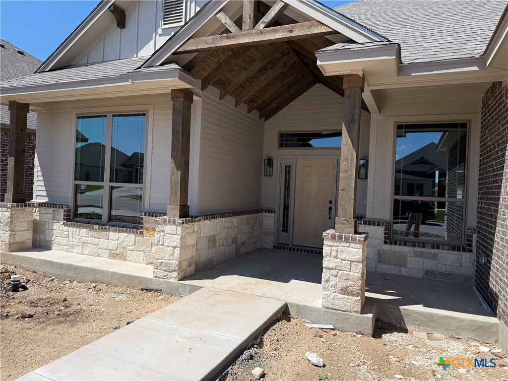 7102 Touchstone Drive Temple, TX 76502 - Photo 1 of 14 a view of a porch with a table and chairs