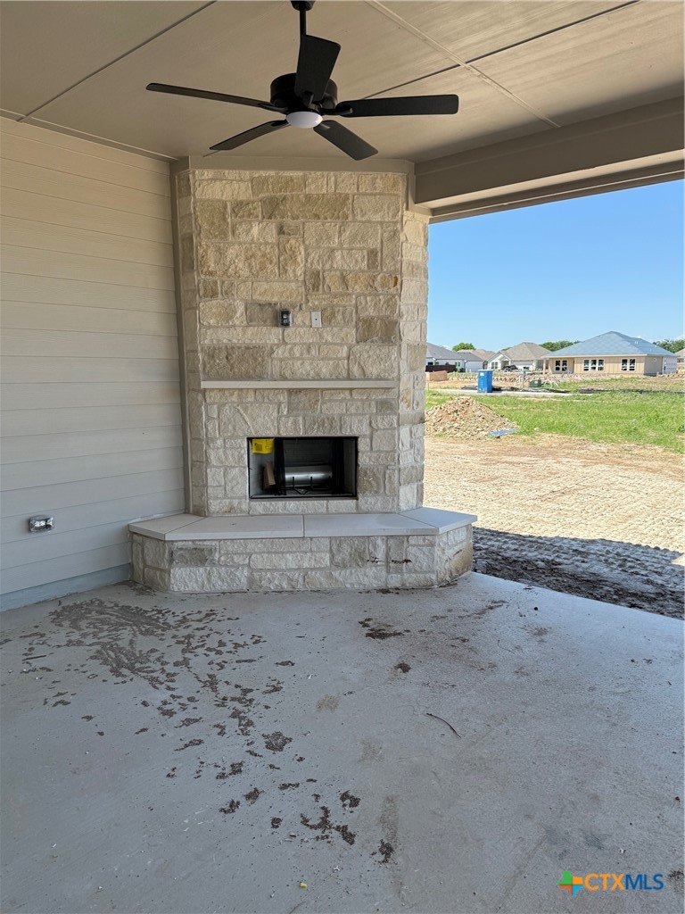 7102 Touchstone Drive Temple, TX 76502 - Photo 14 of 14 a view of empty room with a fireplace and wooden floor
