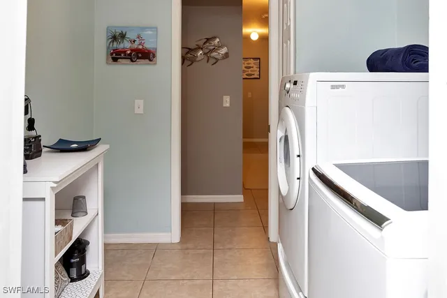 a kitchen with a refrigerator and a stove