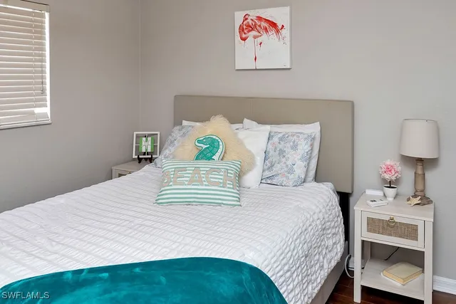 a bedroom with a bed and dresser