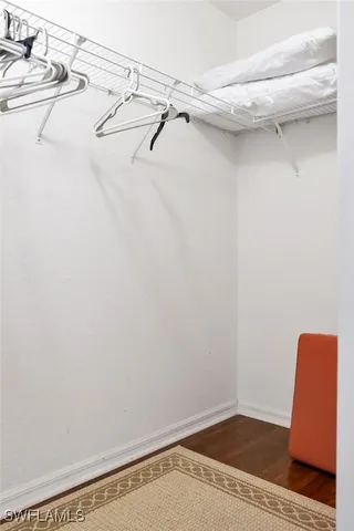 a view of a dining room with furniture wooden floor and chandelier