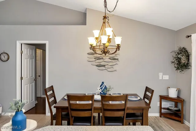 a dining room with table and chairs