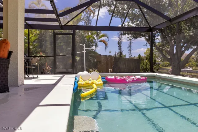 a view of swimming pool with a yard
