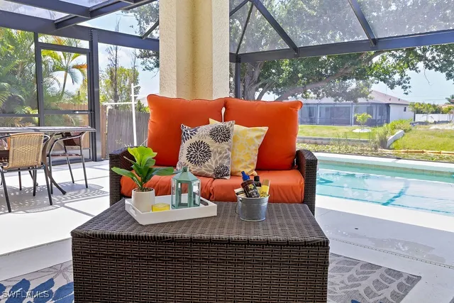 an aerial view of a house with swimming pool