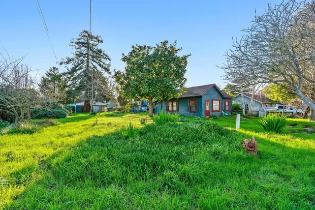 a view of a house with a big yard