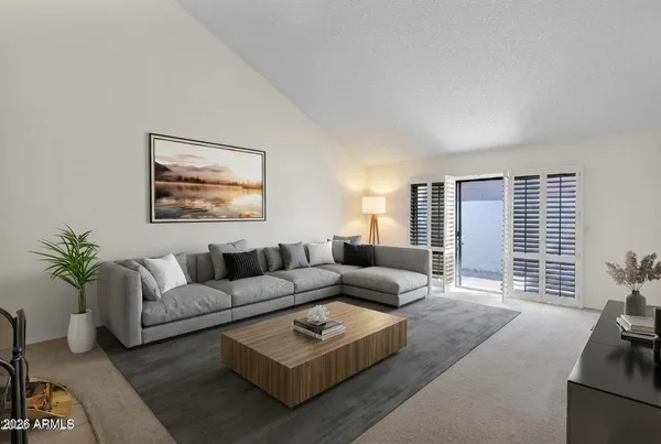 a living room with furniture and a large window
