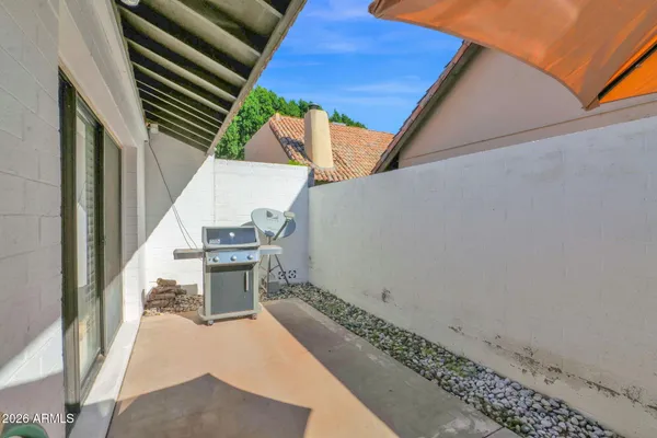 a patio with table and chairs
