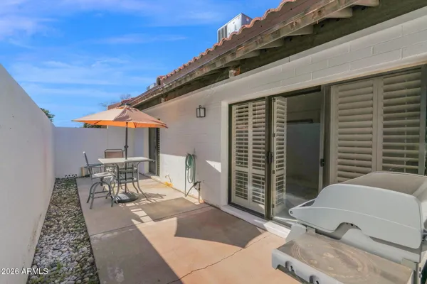 a table and chairs in a patio