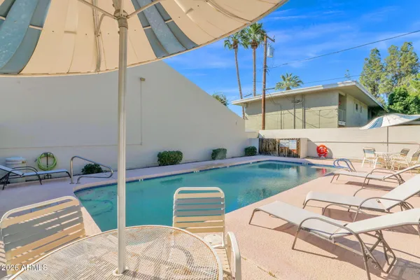 a view of a swimming pool with a patio