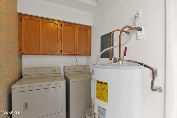 a utility room with dryer and washer