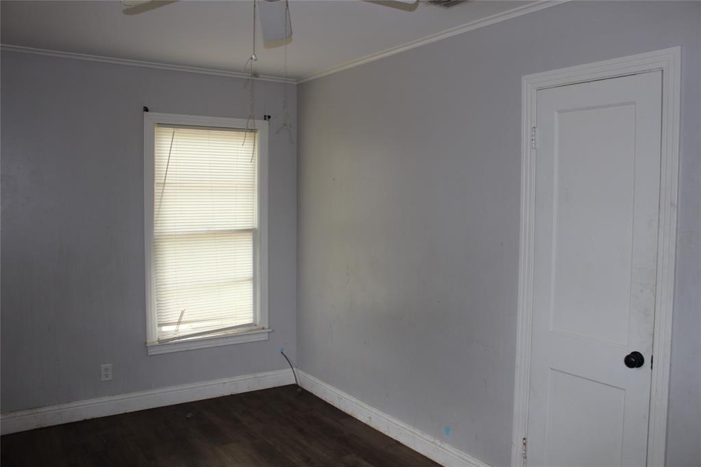 929 Forsythe Street Carthage, TX 75633 - Photo 9 of 9 Empty room featuring ceiling fan and wood-type flooring