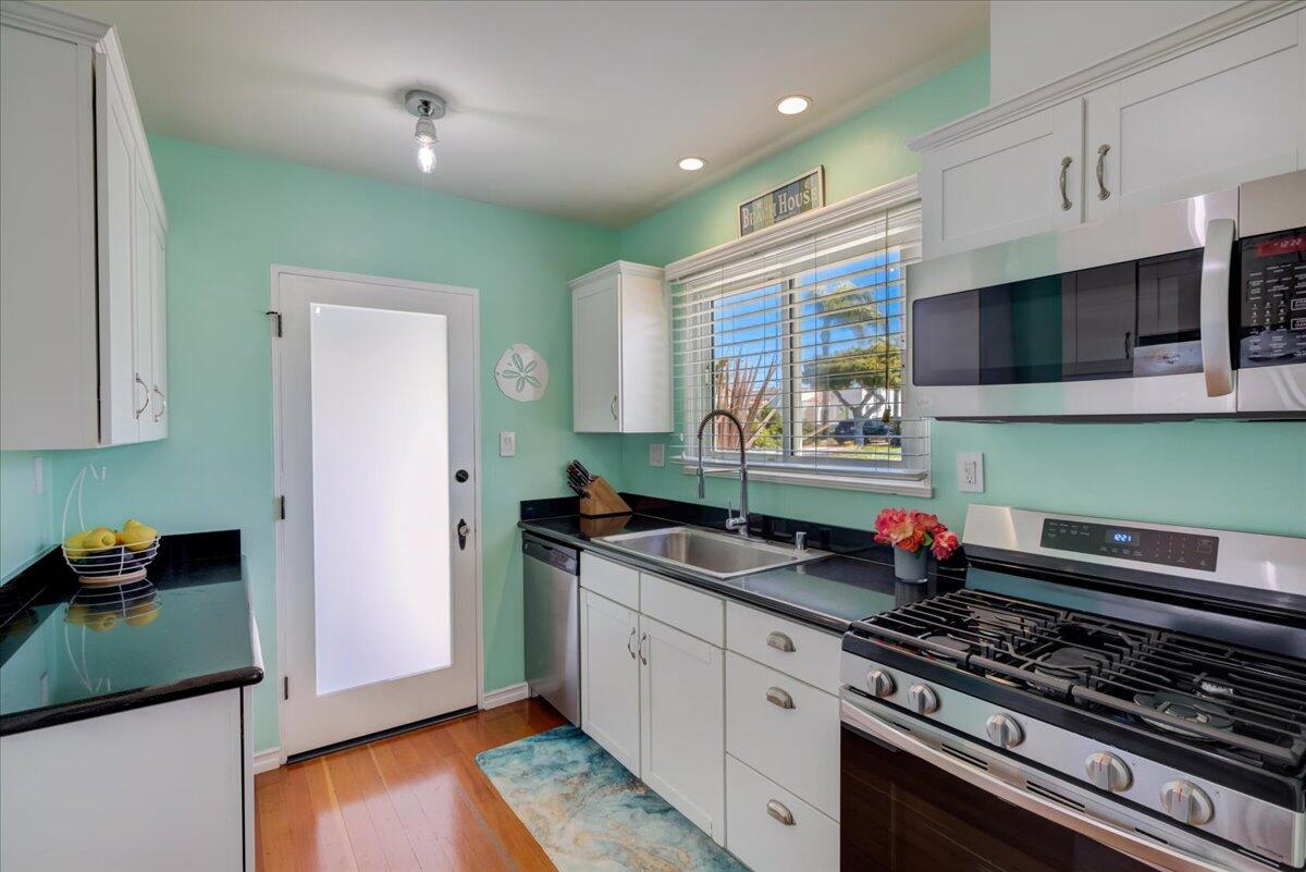 425 Howard Street Ventura, CA 93003 - Photo 16 of 31 a kitchen with stainless steel appliances granite countertop a sink stove and cabinets