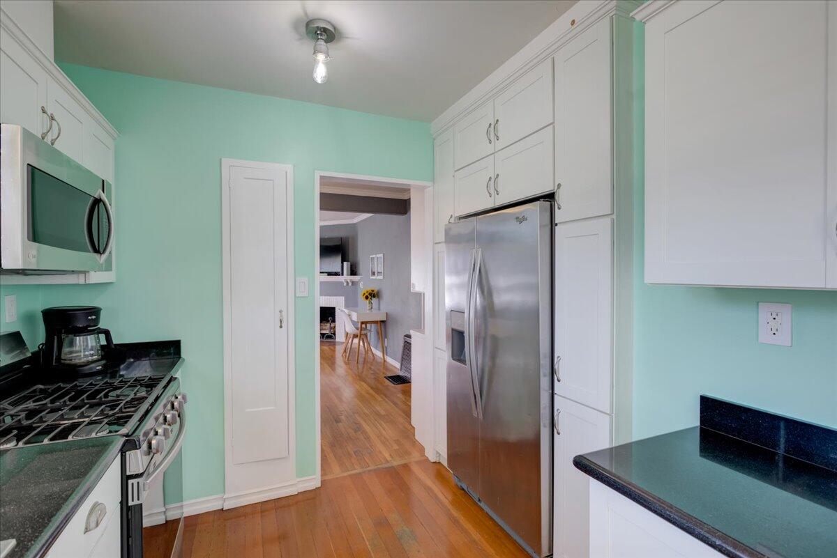 425 Howard Street Ventura, CA 93003 - Photo 17 of 31 a kitchen with stainless steel appliances granite countertop a refrigerator and a stove top oven