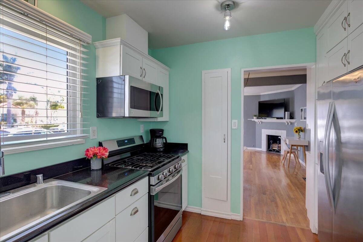 425 Howard Street Ventura, CA 93003 - Photo 18 of 31 a kitchen with granite countertop a sink stainless steel appliances and cabinets
